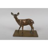 An antique bronze figure of a deer, 16cm high