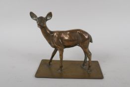 An antique bronze figure of a deer, 16cm high