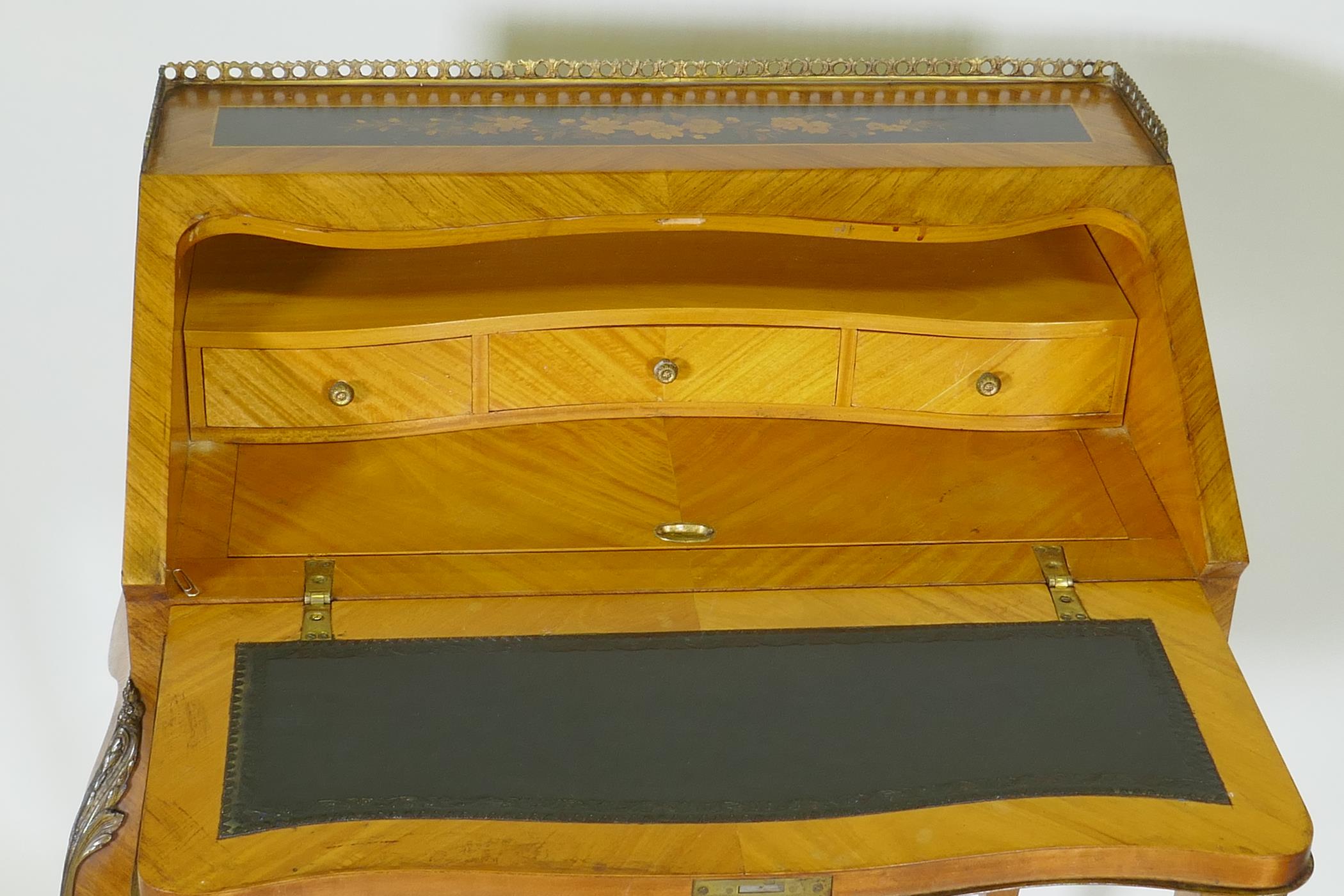 A French marquetry inlaid kingwood bureau-de-dame, with brass mounts, the fall front folding down to - Image 3 of 5