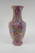 A Chinese polychrome porcelain vase of hexagonal form with allover foliate decoration, 4 character