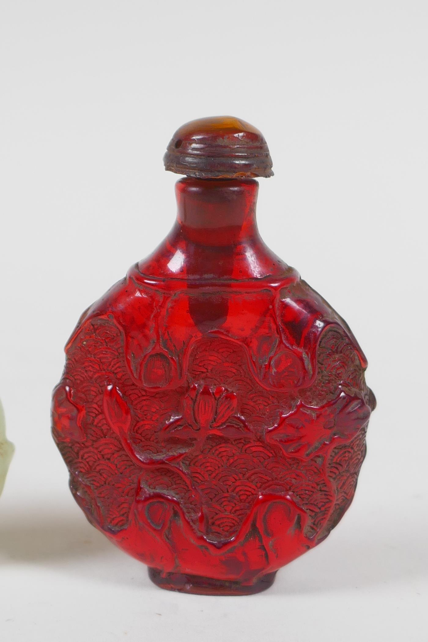 A Chinese carved hardstone roundel in the form of a deer, and a faux amber snuff bottle, 7cm high - Image 3 of 4