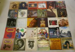 A quantity of vintage Reggae and Soul 12" vinyl LPs and singles, including Bob Marley and The