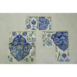 Nine Iznik pottery wall tiles decorated with a foliate pattern, 20 x 23cm