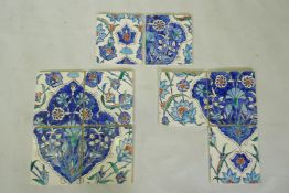 Nine Iznik pottery wall tiles decorated with a foliate pattern, 20 x 23cm