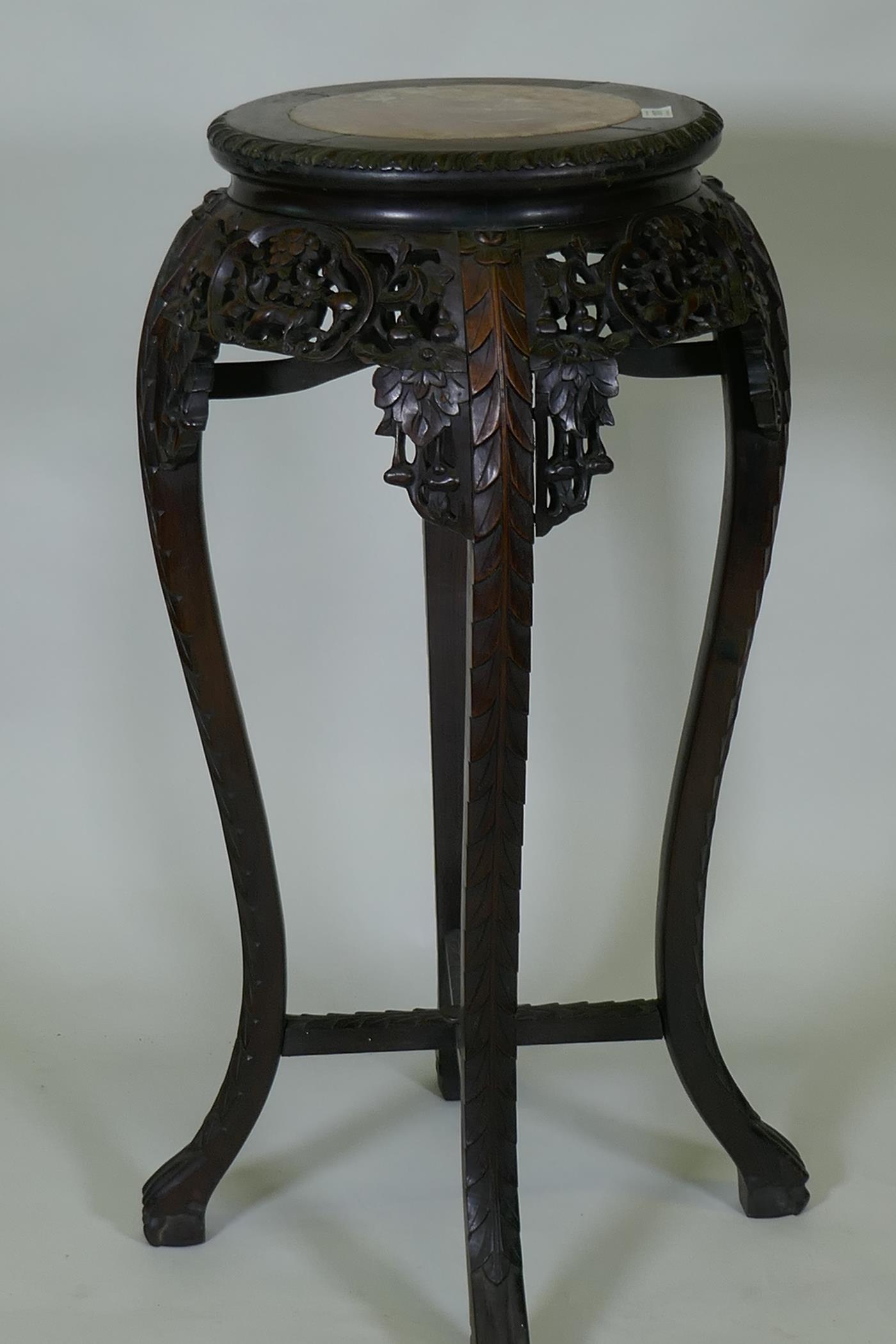 A tall Chinese hardwood jardiniere stand with shaped top inset with marble, with carved and - Image 2 of 3