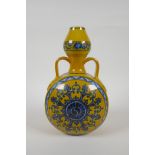 A Chinese yellow ground porcelain moon flask with garlic head shaped neck, two handles and blue
