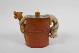 A Chinese sancai crackle glazed pottery teapot with kylin handle and spout, 11cm high