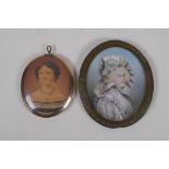 An early C19th miniature watercolour portrait of a lady in a rose metal pendant frame, with