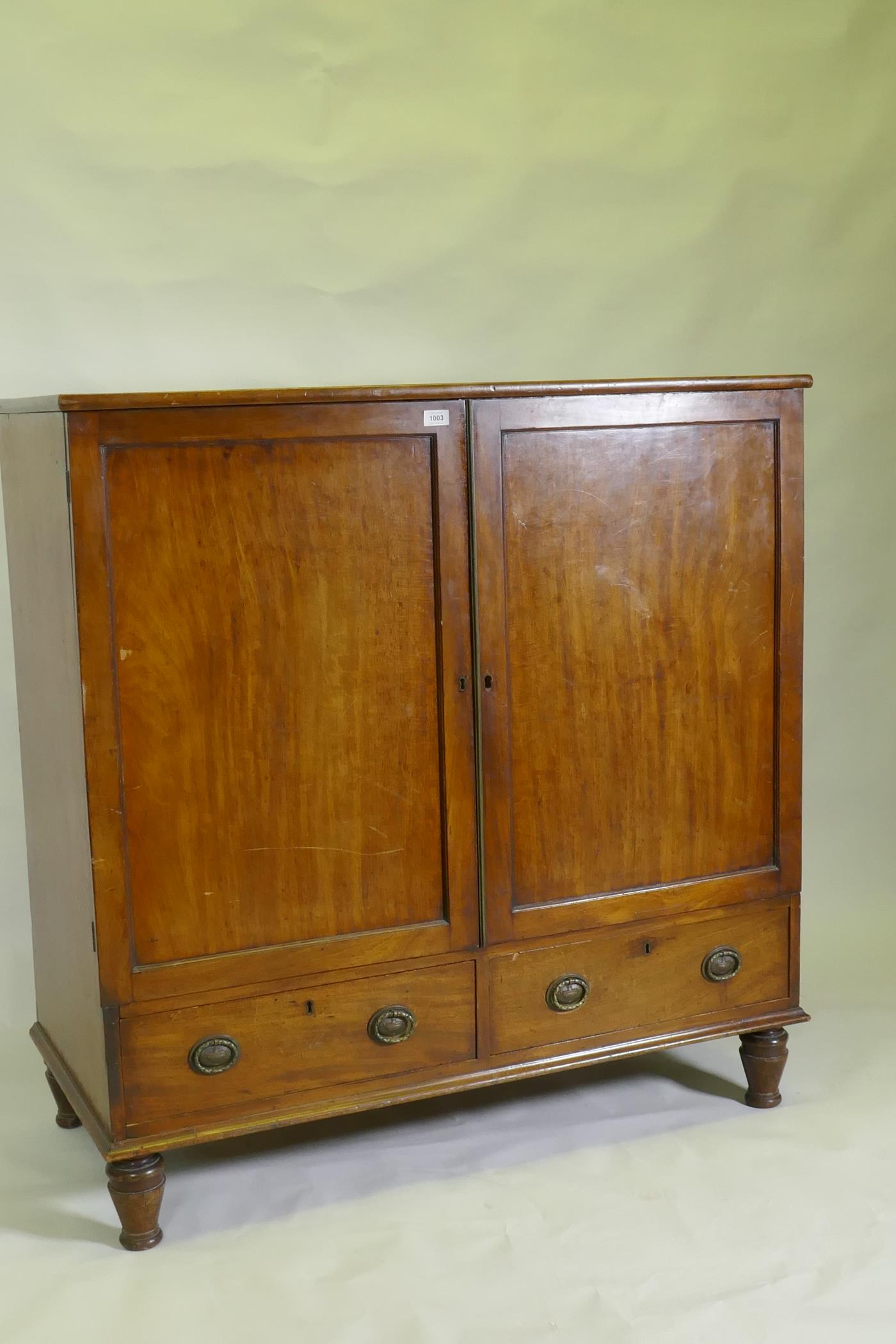 A Regency mahogany press cupboard, with two doors opening to reveal slide drawers over a single - Image 2 of 3