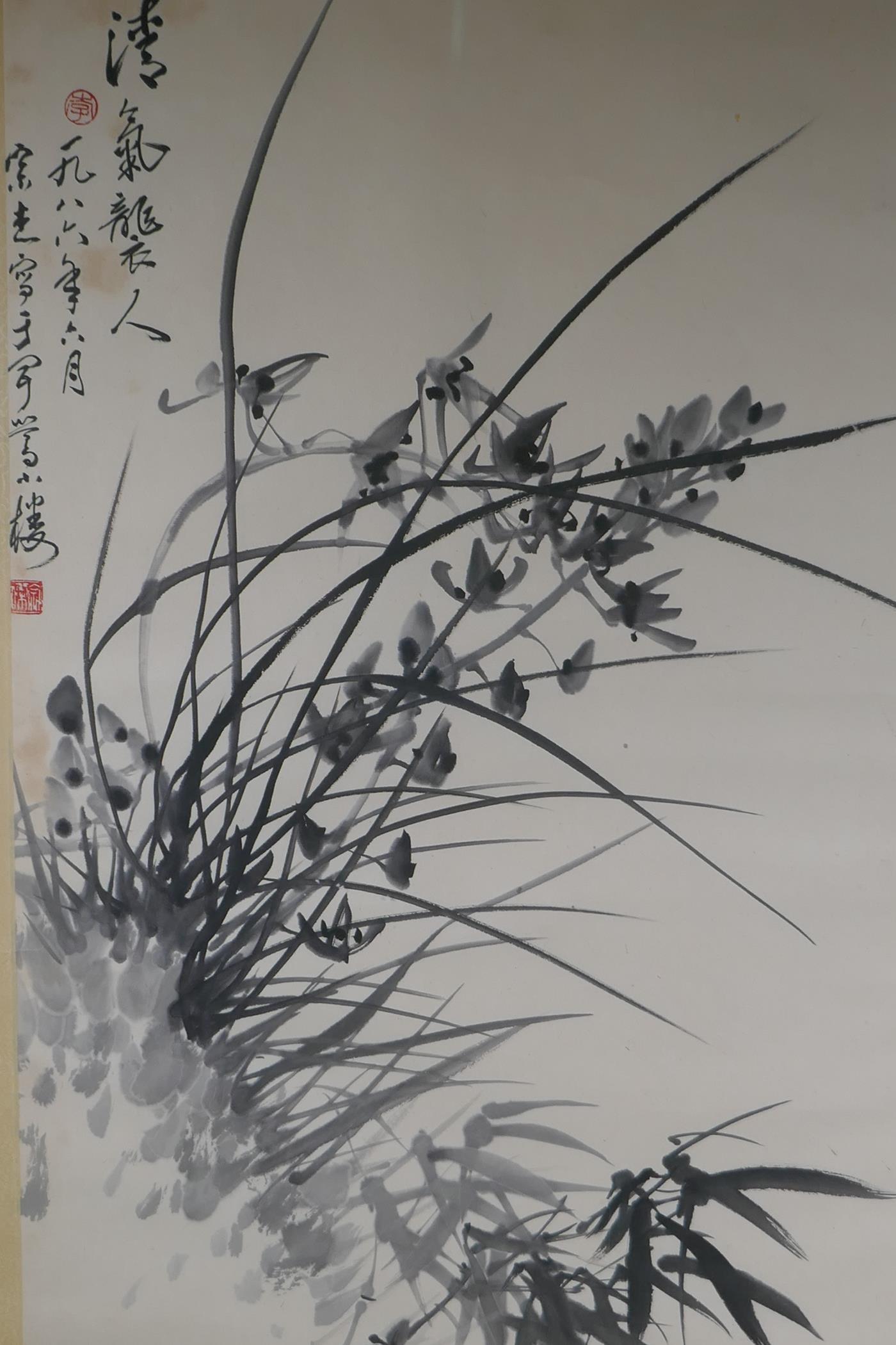 A Chinese monochrome watercolour of orchids and bamboo, signed, early C20th, 44 x 67cm