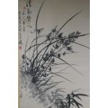 A Chinese monochrome watercolour of orchids and bamboo, signed, early C20th, 44 x 67cm