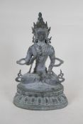 A Sino Tibetan bronze figure of Buddha, with ver de gris patina, 33cm