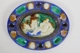 In the manner of Bernard Palissy, an oval shaped ceramic dish with moulded decoration of an allegory