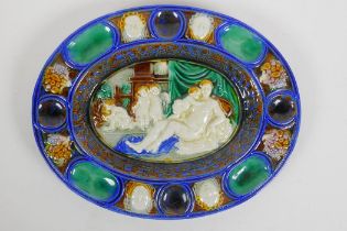 In the manner of Bernard Palissy, an oval shaped ceramic dish with moulded decoration of an allegory