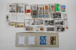 A large quantity of cigarette cards from the 1920s and 30s, including some complete sets, and a