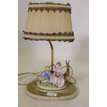 A continental porcelain table lamp, 37cm high with shade