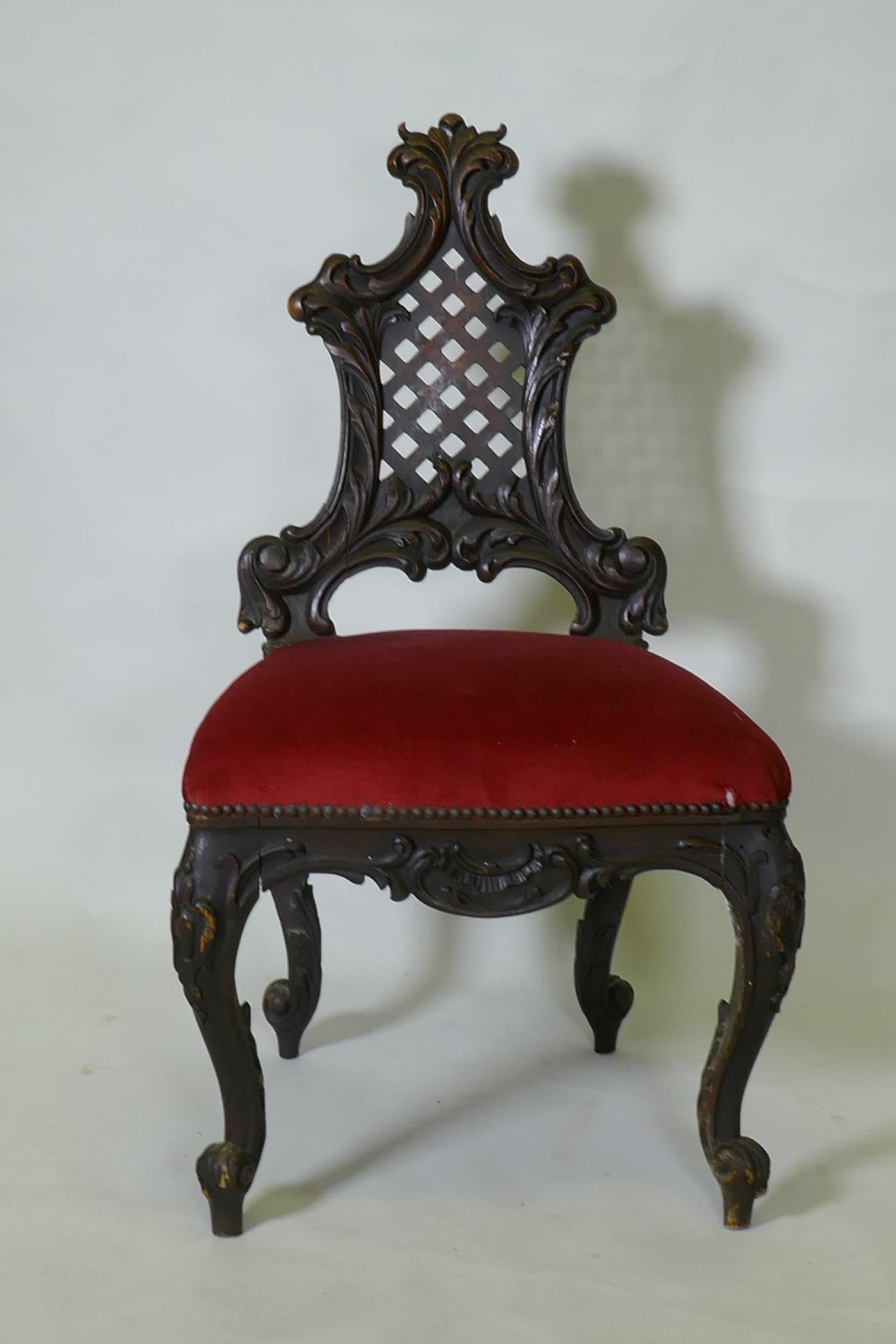 A C19th Chippendale style walnut hall chair, with carved and pierced trellis back, raised on - Image 2 of 3