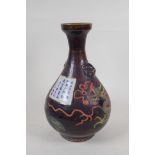 A Chinese polychrome porcelain pear shaped vase with two lion mask handles and incised dragon