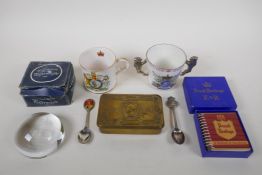 A Princess Mary Christmas 1914 gift tin, together with two commemorative china cups, tea spoons, a
