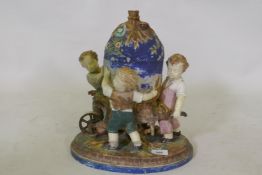 C19th Majolica ceramic centrepiece in the form of three boys with a wheelbarrow, AF, 36cm high