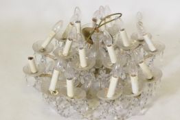 An eighteen branch crystal glass chandelier