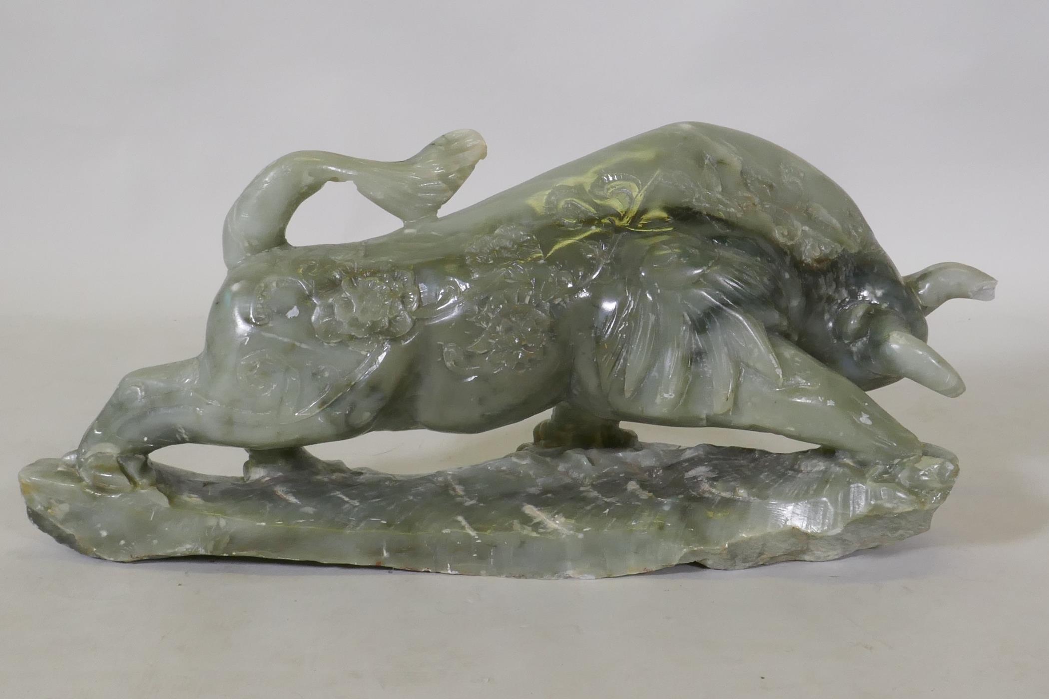 A Chinese carved soapstone figure of a bull, 58 x 28cm - Image 2 of 2