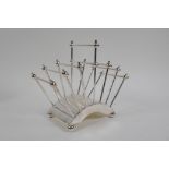 A Christopher Dresser style silver plated letter rack, 18cm high x 21cm long
