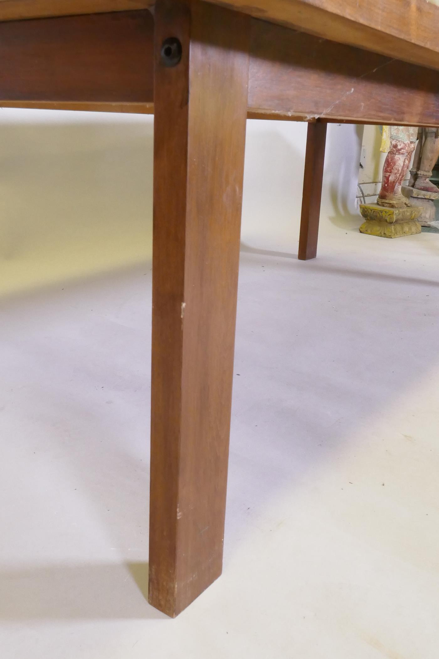 A mid century rosewood coffee table raised on square supports, 70 x 138 x 45cm - Image 3 of 4