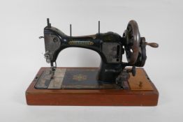 A vintage Hexagon handcrank sewing machine, manufactured by the Standard Sewing Machine Co,