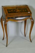 A French marquetry inlaid kingwood bureau-de-dame, with brass mounts, the fall front folding down to