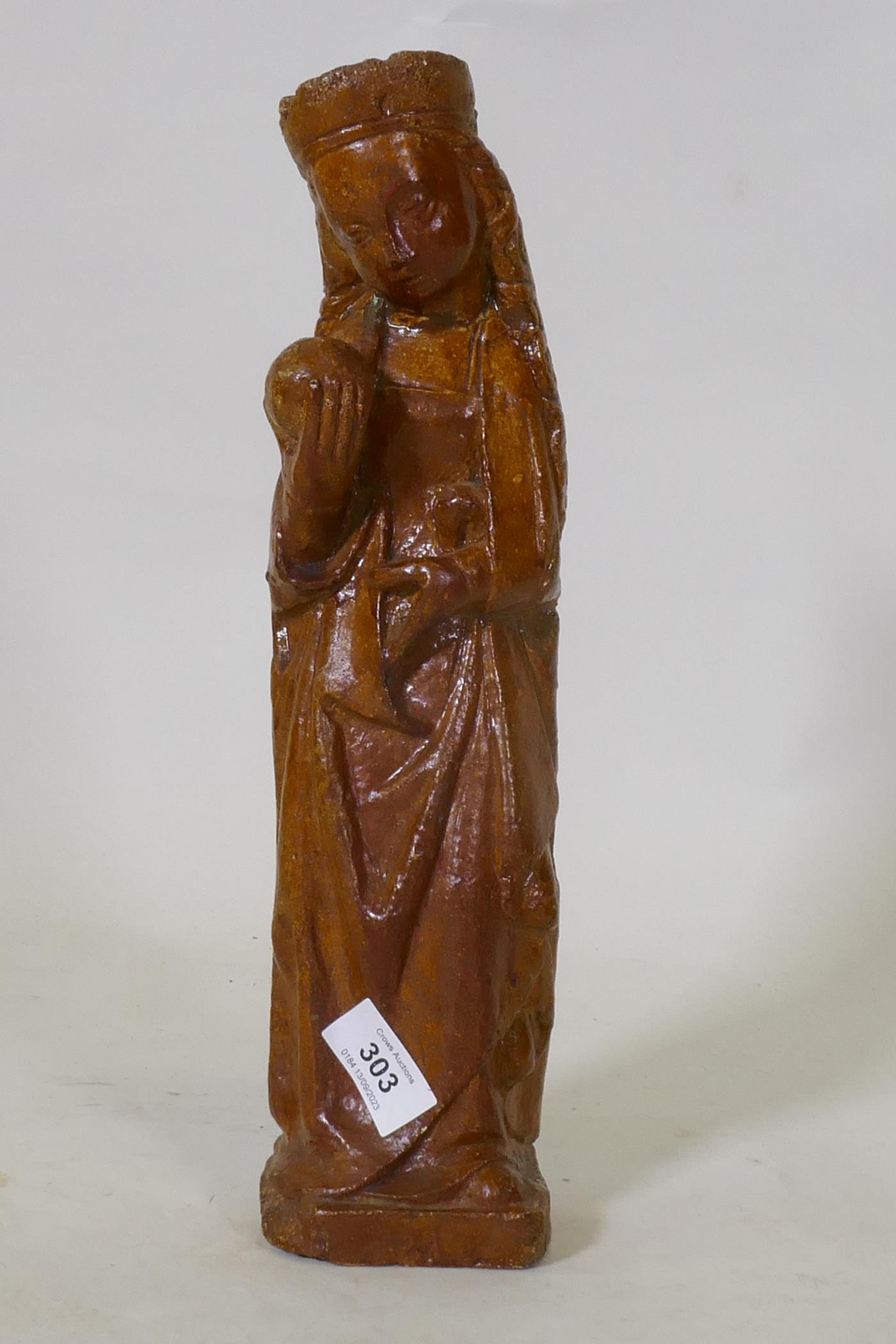 Antique salt glazed stoneware figure of a woman bearing an orb, possibly the Madonna, 36cm high