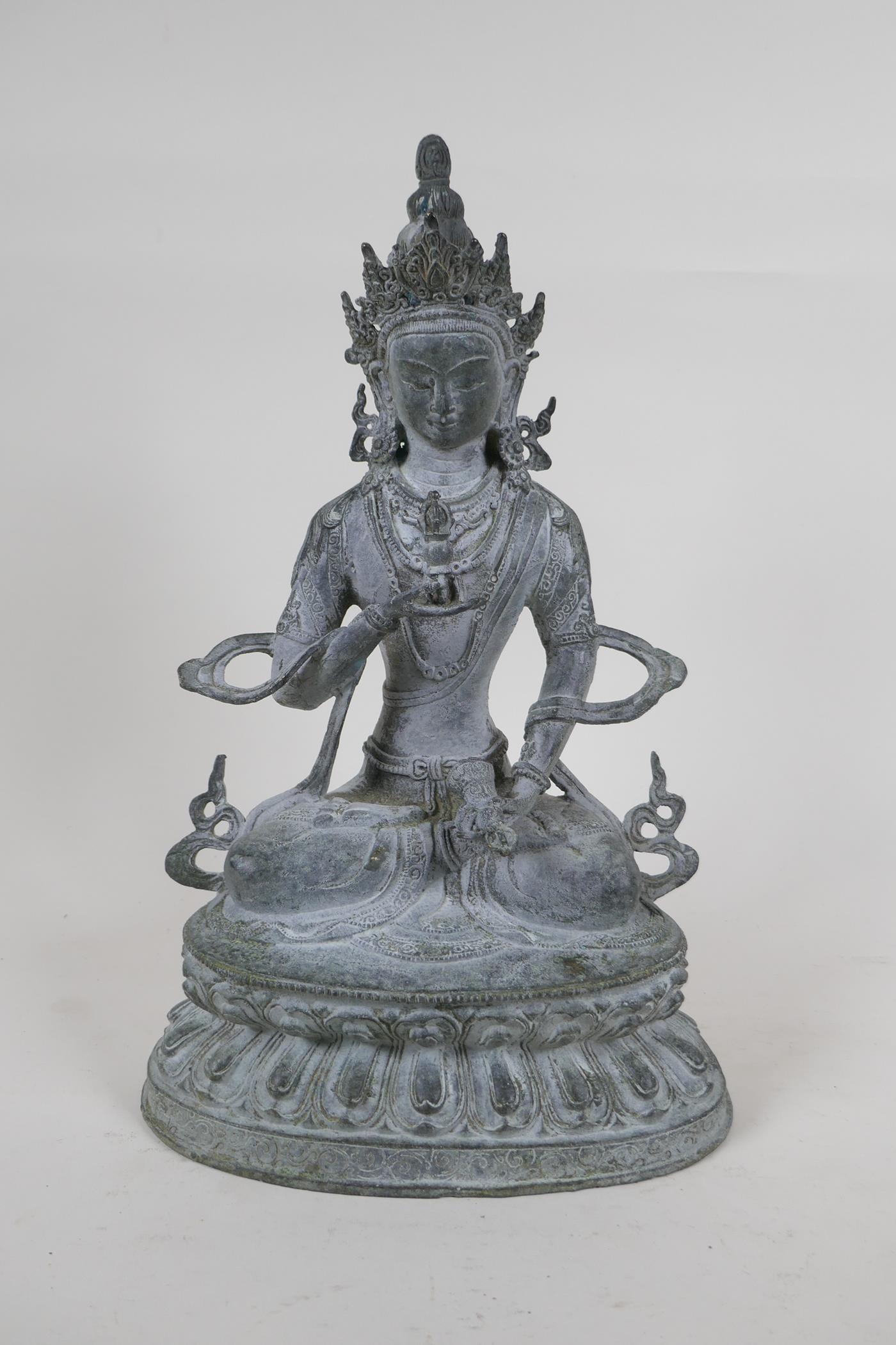 A Sino Tibetan bronze figure of Buddha, with ver de gris patina, 33cm