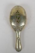 An antique Irish silver plated clothes brush, decorated with inlaid moss agate in the form of clover