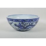 A blue and white porcelain bowl decorated with two dragons, Chinese Xuande 6 character mark to bowl,