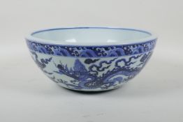 A blue and white porcelain bowl decorated with two dragons, Chinese Xuande 6 character mark to bowl,