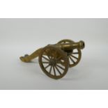 An antique bronze table canon, 33cm long, AF missing wheel nuts