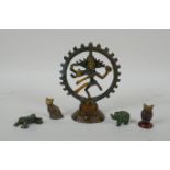 A Tibetan bronzed metal figure of Nataraja, and four smaller incense  stick holders in the for of