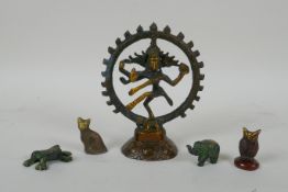 A Tibetan bronzed metal figure of Nataraja, and four smaller incense  stick holders in the for of