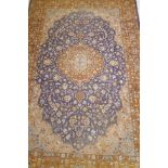 Antique Persian carpet with medallion design on blue field with terracotta borders and all over