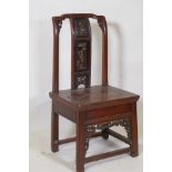 A Chinese hardwood low chair with carved and gilt back splat, 78cm high