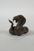 A Japanese style bronze okimono cobra, 4cm high