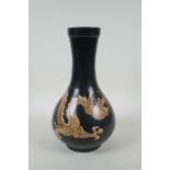 A Chinese Cizhou kiln bottle vase with dragon decoration, 29cm high