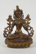 A Sino Tibetan gilt and coppered bronze of the Green Tara, 20cm high