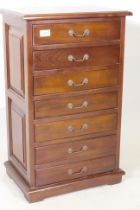 A small hardwood seven drawer semainier chest, with brass drop handles, 44 x 30 x 73