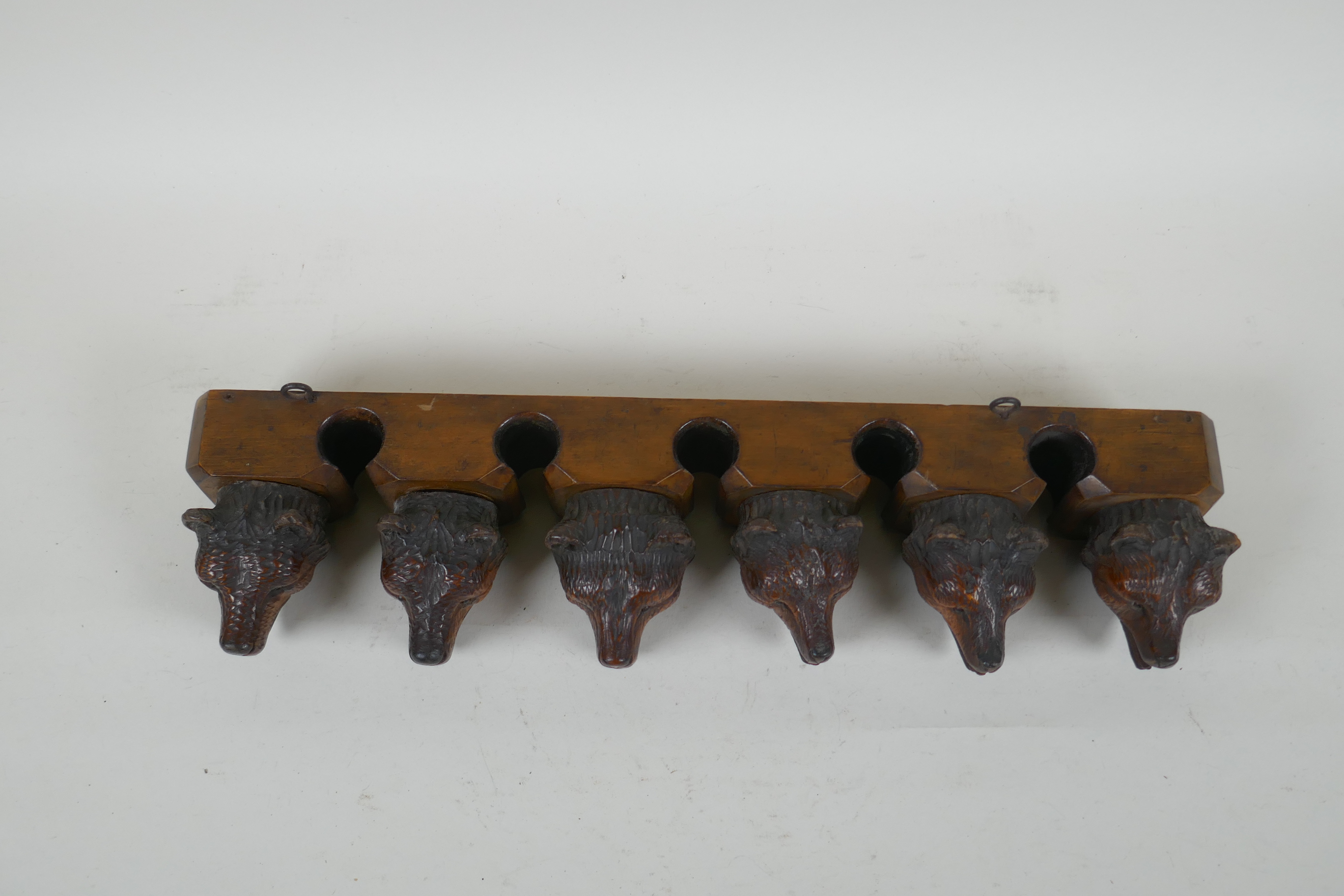 An antique Black Forest carved wood pipe rack with bear's head decoration, a pair of turned wood - Image 4 of 6