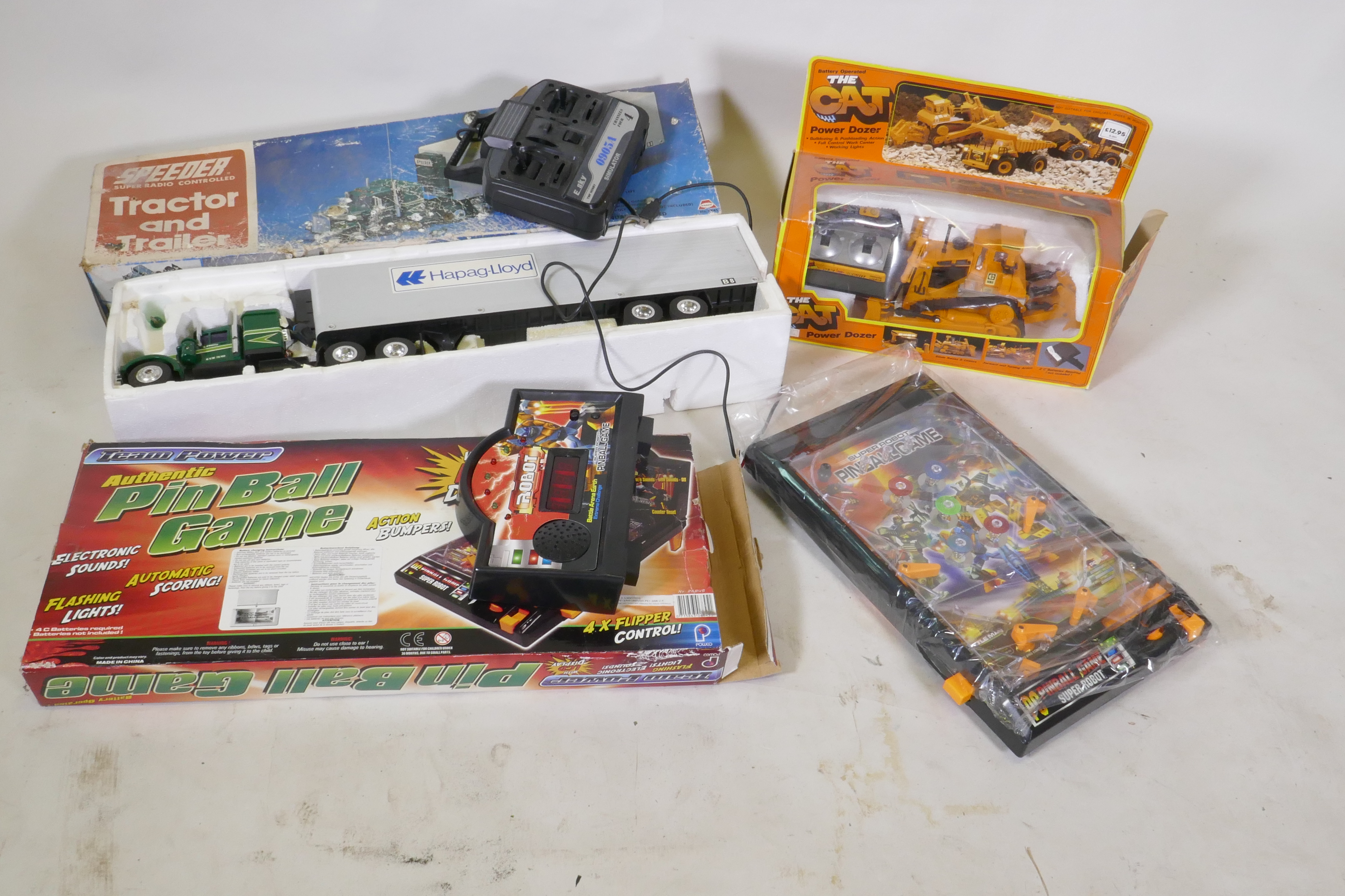 Asahi radio controlled tractor and trailer, 70cm long, pin ball game and cat power dozer
