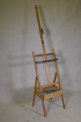 An artist's adjustable easel with single drawer, 190cm high