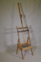 An artist's adjustable easel with single drawer, 190cm high