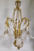 A Faraday & Son ormolu ceiling light, with six suspended lamps each with six individual etched glass
