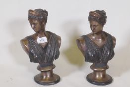 A pair of patinated bronze busts of women in classical attire, 29cm high